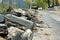 Broken freshly dug up old curbstones with pieces of an asphalt and earth lying on the road in Moscow.