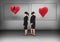 Broken heart or heart in frames with Businesswoman looking in opposite directions