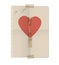 Broken heart painted on the sheet of a notebook and repaired wit