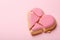 Broken heart shaped cookie on pink background, space for text. Relationship problems concept