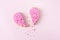 Broken heart, Unrequited love concept. Divorse, quarrel. significant other. broken cookie in heart shape on pink background.