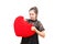 Broken heart woman is angry and try to tear heart pillow