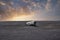 Broken military airplane wreck at famous beach in Solheimasandur in sunset