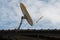 Broken and old satellite dish on the roof