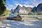 Broken old wooden boat on the sea. Low tide. Sunny clear weather. On the background of the sea. Tropical sandy beach