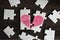 Broken pink heart on puzzles