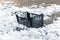 Broken plastic crate isolated on snow background