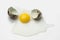 Broken quail egg with with shell and yolk