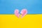 Broken red heart on the ukrainian flag background