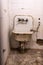 Broken rusty and dirty sink and toilet bowl from a cell at Alcatraz Prison San Francisco California USA