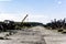 Broken and rusty old farm, military and construction vehicles, set on a runway.