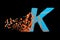 Broken shattered fast sporty alphabet letter K uppercase. Crushed speedy racing font. 3D render isolated on black background.