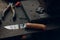 broken steel knife blade on wooden table