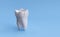 Broken tooth isolated on blue background
