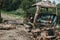 Broken tractor in a wild forest