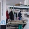 A broken wall of a glass bus stop and people near the road with cars - Moscow, Russia, 03 04 2021