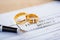 Broken wedding rings on divorce decree.