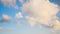 Broken white cumulus stratus clouds after a rain on a background of blue sky timelapse