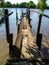 A broken wooden dock by the Rio de La Plata river in Isla Paulino, Buenos Aires, Argentina