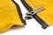 Broken zipper on yellow shirt jacket. Detail close-up photo