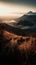 The Bromo mountains landscape during a heavy misty morning with a hint of golden hour is a stunning and atmospheric image that cap