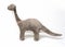 Brontosaurus dinosaur plush toy side view on white background