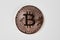 Bronze bitcoin on white background