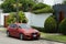 Bronze BMW 120i parked alongside a house, Lima