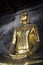 Bronze buddha statue at Bangkok temple in Thailand in Asian culture and religion concept