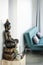 Bronze buddha statue interior design detail in modern asian home