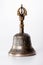 A bronze buddhist hand bell isolated over a white background