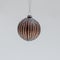 Bronze Christmas tree ball ornamented with shiny silver stripes