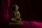 Bronze colored figurine of Buddha