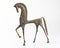 Bronze etruscan horse sculpture on white background.