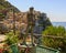 Bronze Lady of the Grapes statue in Manarola, the second smallest of the famous Cinque Terre towns, Italy