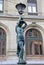 Bronze lamppost shaped as antique caryatide near Palais Garnier, the Paris Opera House in Paris, France