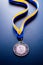 Bronze medal on a blue background