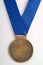 Bronze medal on blue ribbon