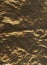 Bronze metallic or plastic imitation of retro foil texture closeup. Crumpled grunge abstract flatlay background. Close-up,