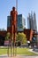 Bronze sculpture of aboriginal indigenous. Traditional and modern buildings at the background. City centre CBD Perth, West