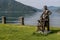 A bronze sculpture depicting a knife grinder on the lakefront of Bissone, Switzerland