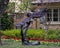 Bronze sculpture of a large fierce bald eagle in flight in a yard in Dallas, Texas