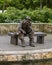 Bronze sculpture of an old man fishing by Gary Price at the Dallas Arboretum and Botanical Garden