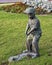 Bronze sculpture of a young boy golfing, located on the lawn of a business in Dallas, Texas.