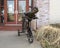 Bronze sculpture of a young boy on a tricycle outside the Crucible Foundry & Art Gallery in Norman, Oklahoma.