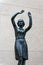 The bronze sculpture of a young lady at the wall of National Bank of Finland