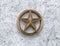 Bronze star on cement background