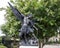 Bronze statue of the Archangel Saint Michael defeating Lucifer at the Blessed Sacrament Catholic Church in Dallas, Texas.