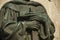 Bronze statue detail of priest hands holding a cross at Caceres