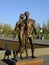 A bronze statue featuring a young couple in Astana